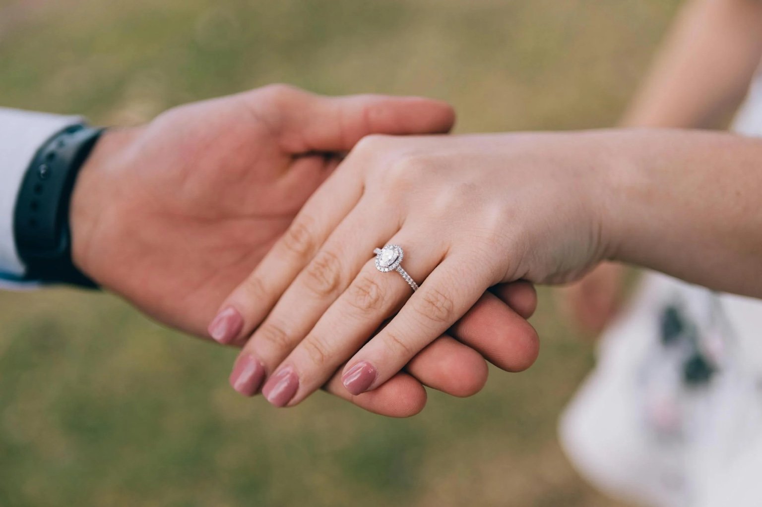 Man holding fiance's hand