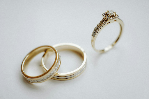 Three wedding bands on a grey background